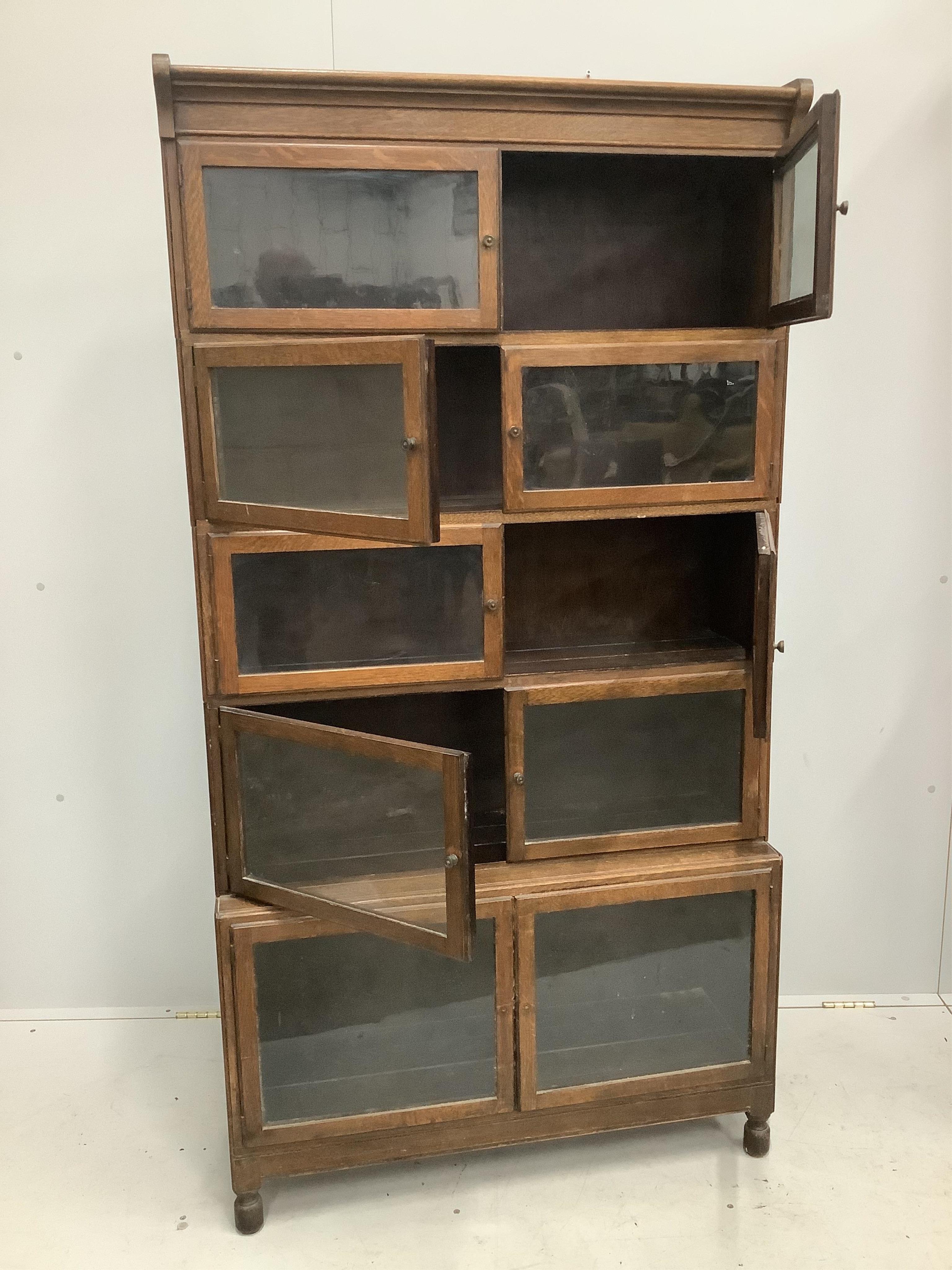 A Globe Wernicke style oak five section bookcase, width 89cm, depth 30cm, height 170cm. Condition - fair